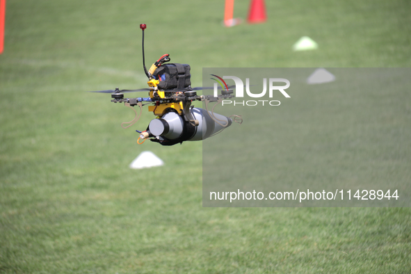 A kamikaze drone with a warhead is performing a demonstration flight during the 2nd Drone Racing Tournament by the Federation of Military Te...