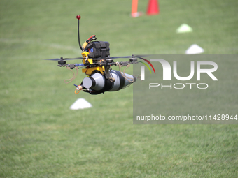 A kamikaze drone with a warhead is performing a demonstration flight during the 2nd Drone Racing Tournament by the Federation of Military Te...