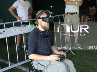 A participant in the 2nd Drone Racing Tournament by the Federation of Military Technological Sports of Ukraine is flying a drone in Bilohoro...