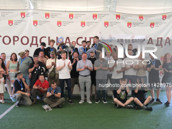 Participants in the 2nd Drone Racing Tournament by the Federation of Military and Technological Sports of Ukraine are posing for a photo in...