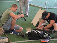 Participants in the 2nd Drone Racing Tournament by the Federation of Military Technological Sports of Ukraine are setting up drones in Biloh...