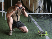 A participant in the 2nd Drone Racing Tournament by the Federation of Military and Technological Sports of Ukraine is getting ready to fly a...