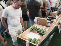 A man is looking at the drone bombs during the exhibition held as part of the 2nd Drone Racing Tournament by the Federation of Military and...