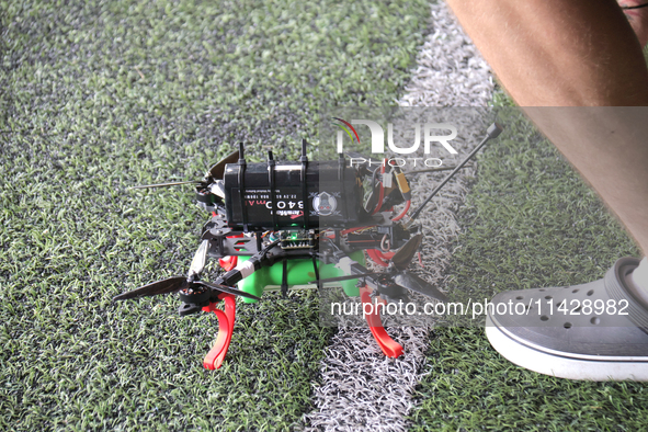 A cargo drone is being seen during the 2nd Drone Racing Tournament by the Federation of Military and Technological Sports of Ukraine in Bilo...