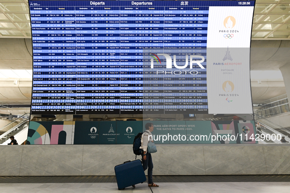 PARIS, FRANCE - JULY 22:   
Airport flights information electronic board with Paris 2024 Olympics and Paralympics logos, on July 22, 2024, i...