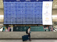 PARIS, FRANCE - JULY 22:   
Airport flights information electronic board with Paris 2024 Olympics and Paralympics logos, on July 22, 2024, i...