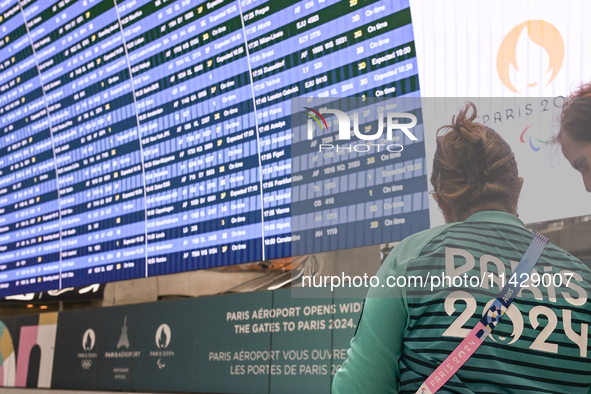 PARIS, FRANCE - JULY 22:   
Airport flights information electronic board with Paris 2024 Olympics and Paralympics logos, on July 22, 2024, i...