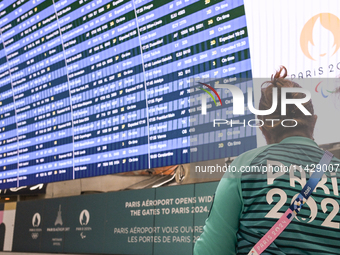 PARIS, FRANCE - JULY 22:   
Airport flights information electronic board with Paris 2024 Olympics and Paralympics logos, on July 22, 2024, i...