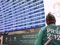 PARIS, FRANCE - JULY 22:   
Airport flights information electronic board with Paris 2024 Olympics and Paralympics logos, on July 22, 2024, i...