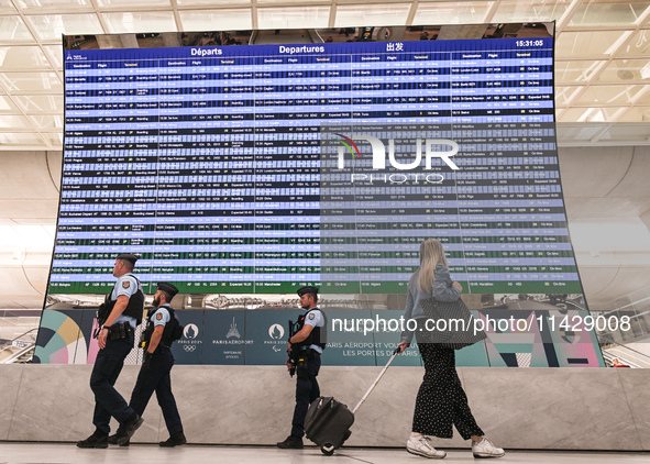 PARIS, FRANCE - JULY 22:   
Airport flights information electronic board with Paris 2024 Olympics and Paralympics logos, on July 22, 2024, i...