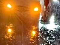 Vehicles are driving in a flooded area after heavy rain in Zhengzhou, China, on July 22, 2024. (