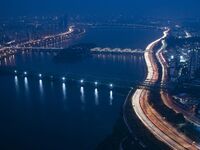 An evening scene of Seoul's Han River and Olympic Blvd is being viewed from the 63 Building in Seoul, South Korea. The 63 Building is a skys...