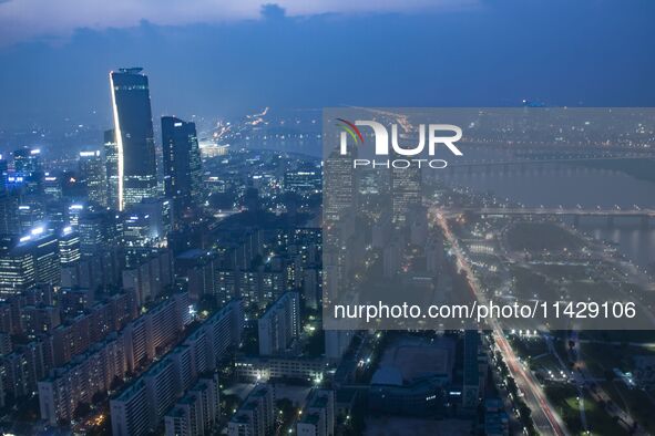 An evening view of Seoul's Han River and Yeouido Island, seen from the 63 Building in Seoul, South Korea. The 63 Building is a skyscraper on...