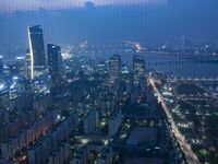 An evening view of Seoul's Han River and Yeouido Island, seen from the 63 Building in Seoul, South Korea. The 63 Building is a skyscraper on...