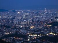 An evening scene of Seoul's downtown is being viewed from Bugaksan in Seoul, South Korea. Bugaksan is a mountain in the north of Seoul, Sout...