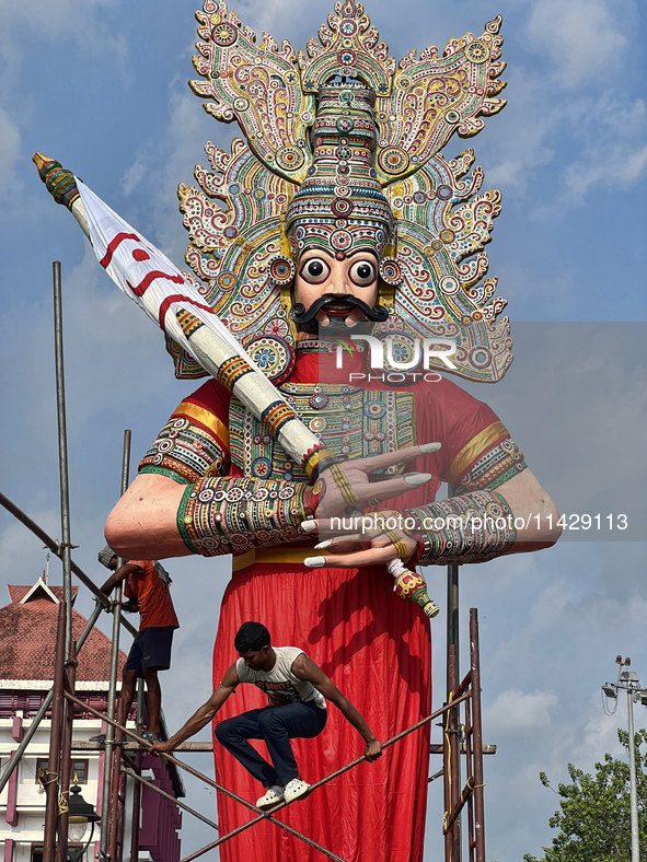 Workers are erecting giant idols of the Pandavas along the eastern entrance of the historic Sree Padmanabhaswamy Temple in preparation for t...