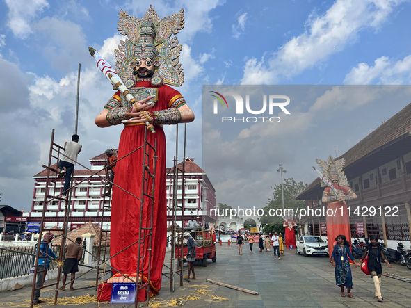 Workers are erecting giant idols of the Pandavas along the eastern entrance of the historic Sree Padmanabhaswamy Temple in preparation for t...