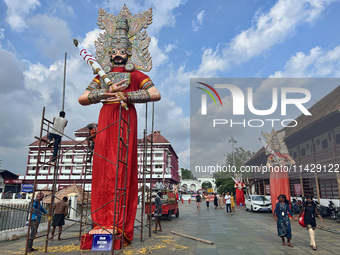 Workers are erecting giant idols of the Pandavas along the eastern entrance of the historic Sree Padmanabhaswamy Temple in preparation for t...