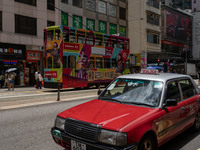 A taxi cab is driving in Hong Kong, China, on July 22, 2024. (