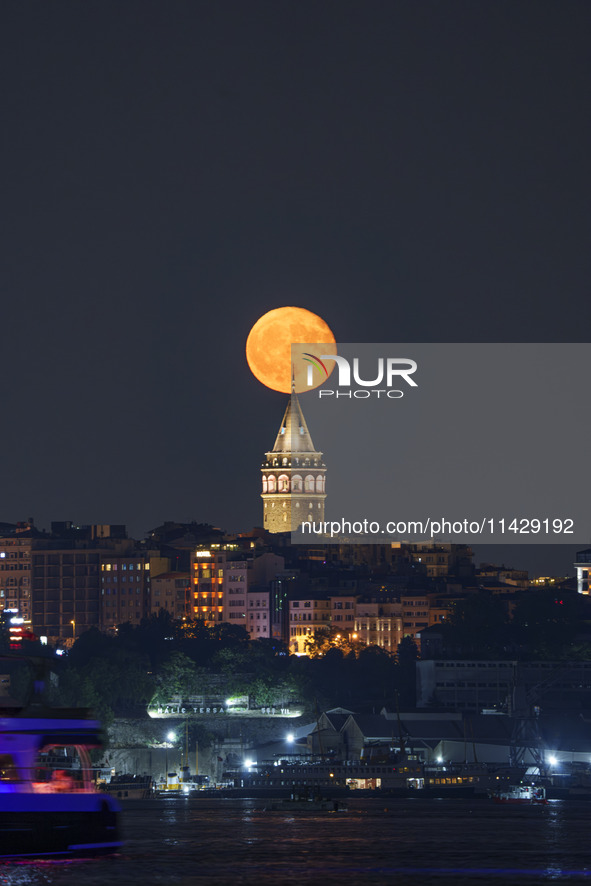 Moonrise Over The Galata Tower Istanbul, Turkiye On 22nd July 2024.