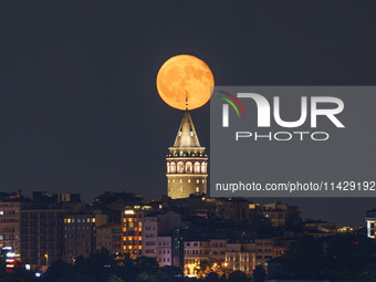 Moonrise Over The Galata Tower Istanbul, Turkiye On 22nd July 2024.(