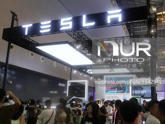 Visitors are viewing Tesla's humanoid robot Optimus Prime II at WAIC in Shanghai, China, on July 7, 2024. (