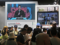 Visitors are viewing Tesla's humanoid robot Optimus Prime II at WAIC in Shanghai, China, on July 7, 2024. (