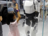 Visitors are viewing Tesla's humanoid robot Optimus Prime II at WAIC in Shanghai, China, on July 7, 2024. (