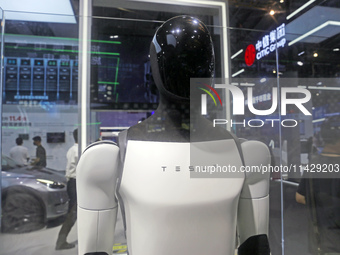 Visitors are viewing Tesla's humanoid robot Optimus Prime II at WAIC in Shanghai, China, on July 7, 2024. (