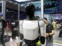 Visitors are viewing Tesla's humanoid robot Optimus Prime II at WAIC in Shanghai, China, on July 7, 2024. (