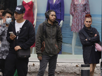 A view of passers-by in the centre of Mexico City, Mexico, on Monday, after Mexico City is reaching a record temperature of 34.2 degrees Cel...