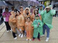 Passers-by are taking shelter in the centre of Mexico City, Mexico, on Monday, after the city reached a record temperature of 34.2 degrees C...