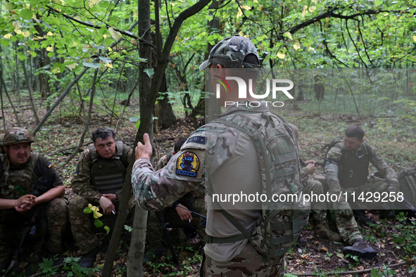 A serviceman of the Smurfs Task Force Police Regiment is attending a tactical exercise in Ukraine, on July 22, 2024. 