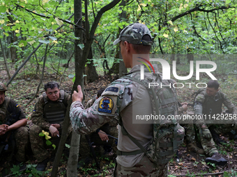 A serviceman of the Smurfs Task Force Police Regiment is attending a tactical exercise in Ukraine, on July 22, 2024. (