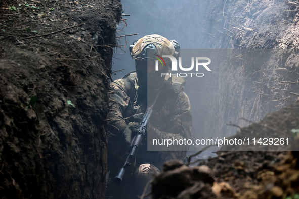 A serviceman of the 3rd Colonel Petro Bolbochan Brigade of Operational Assignment of Ukraine's National Guard (also known as the Spartan Bri...