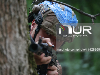 A serviceman of the 3rd Colonel Petro Bolbochan Brigade of Operational Assignment of Ukraine's National Guard (also known as the Spartan Bri...