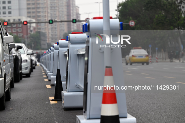 An intelligent mobile guardrail of a ''tidal lane robot'' is being seen at Shenyang Youth North Street in Shenyang, Liaoning province, China...