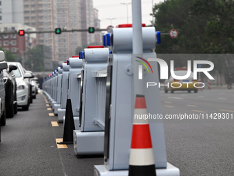 An intelligent mobile guardrail of a ''tidal lane robot'' is being seen at Shenyang Youth North Street in Shenyang, Liaoning province, China...