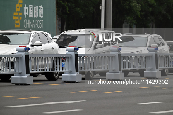 An intelligent mobile guardrail of a ''tidal lane robot'' is being seen at Shenyang Youth North Street in Shenyang, Liaoning province, China...