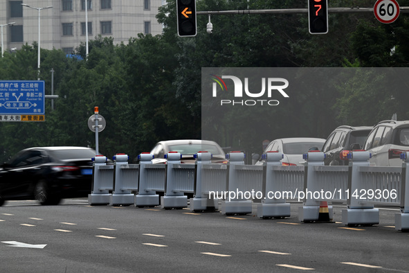 An intelligent mobile guardrail of a ''tidal lane robot'' is being seen at Shenyang Youth North Street in Shenyang, Liaoning province, China...