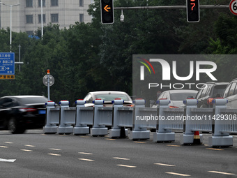 An intelligent mobile guardrail of a ''tidal lane robot'' is being seen at Shenyang Youth North Street in Shenyang, Liaoning province, China...