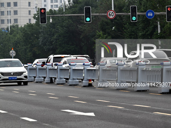 An intelligent mobile guardrail of a ''tidal lane robot'' is being seen at Shenyang Youth North Street in Shenyang, Liaoning province, China...