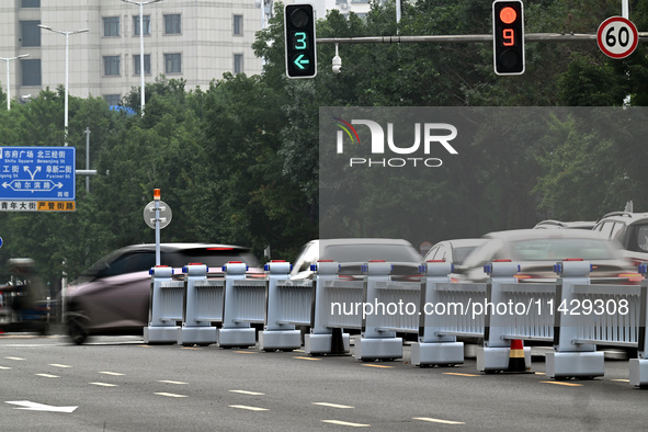 An intelligent mobile guardrail of a ''tidal lane robot'' is being seen at Shenyang Youth North Street in Shenyang, Liaoning province, China...