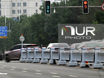 An intelligent mobile guardrail of a ''tidal lane robot'' is being seen at Shenyang Youth North Street in Shenyang, Liaoning province, China...