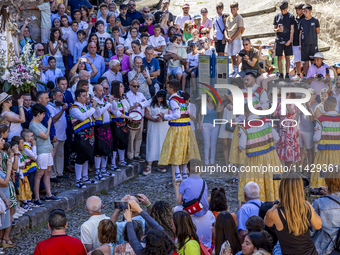 The dancers are descending in Anguiano, Spain, on July 22, 2024. (