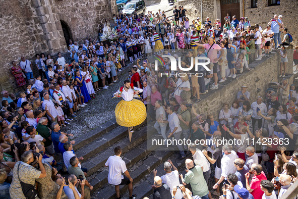 The dancers are descending in Anguiano, Spain, on July 22, 2024. 