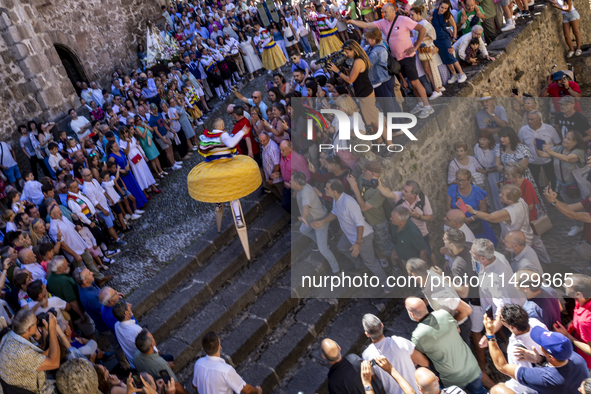 The dancers are descending in Anguiano, Spain, on July 22, 2024. 