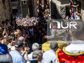 The dancers are descending in Anguiano, Spain, on July 22, 2024. (