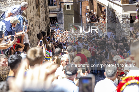 The dancers are descending in Anguiano, Spain, on July 22, 2024. 