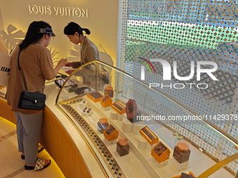 Visitors are shopping at Louis Vuitton's first chocolate store in Shanghai, China, on July 23, 2024. (